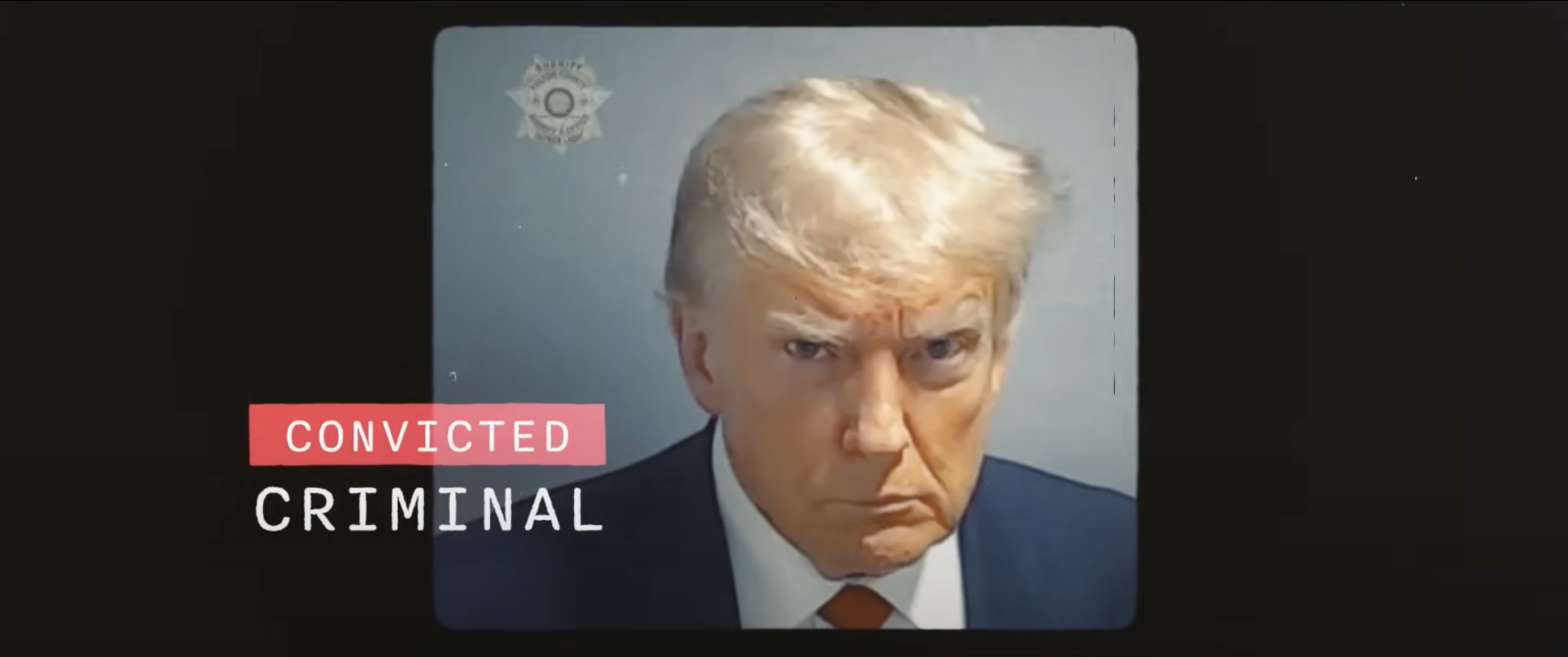 Screenshot of Donald Trump's mug shot with the words "Convicted criminal" styled next to it